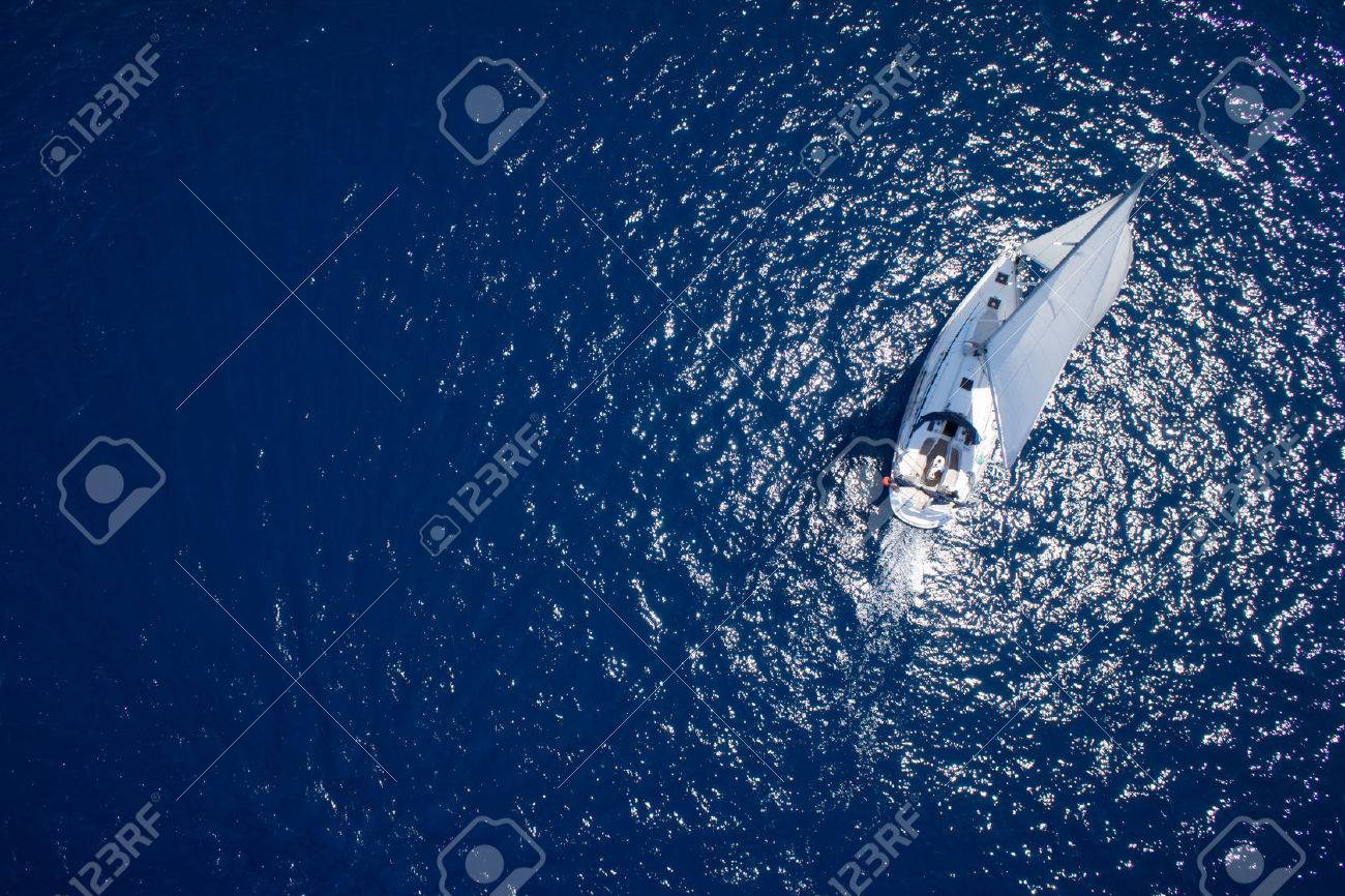 Amazing view to Yacht sailing in open sea at windy day. Drone view - birds eye angle - 32773881 Amazing view to Yacht sailing in open sea at windy day. Drone view - birds eye angle - 32773881