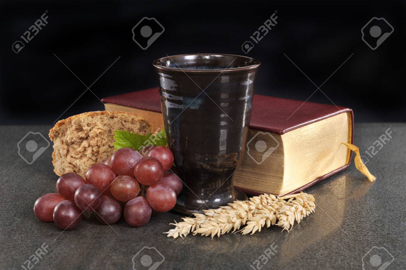 bread wine and bible for sacrament or communion stock photo