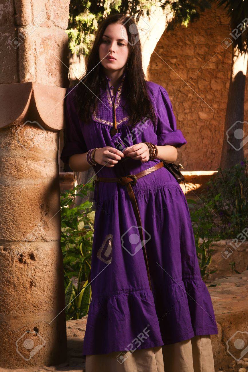 Brunette Girl In A Medieval Suit In A Agia Napa Medieval Monastery  Background Stock Photo, Picture and Royalty Free Image. Image 16793623., image size:866x1300