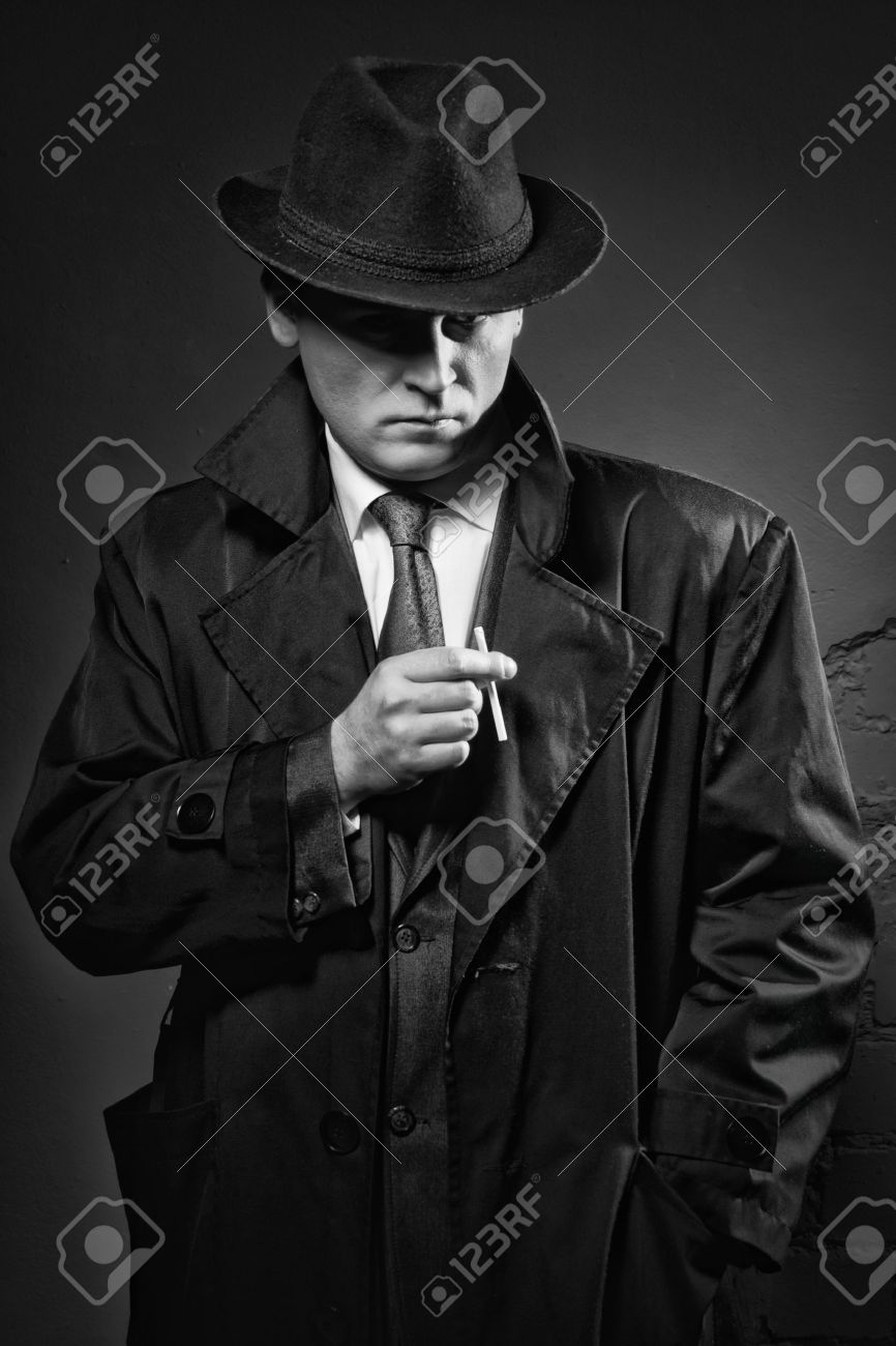 film noir retro styled fashion portrait of a detective stock photo