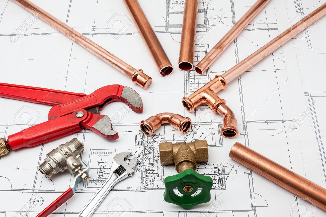 Plumbing Tools Arranged On House Plans whit wrench and pipe cutter - 34217539 Plumbing Tools Arranged On House Plans whit wrench and pipe cutter - 34217539