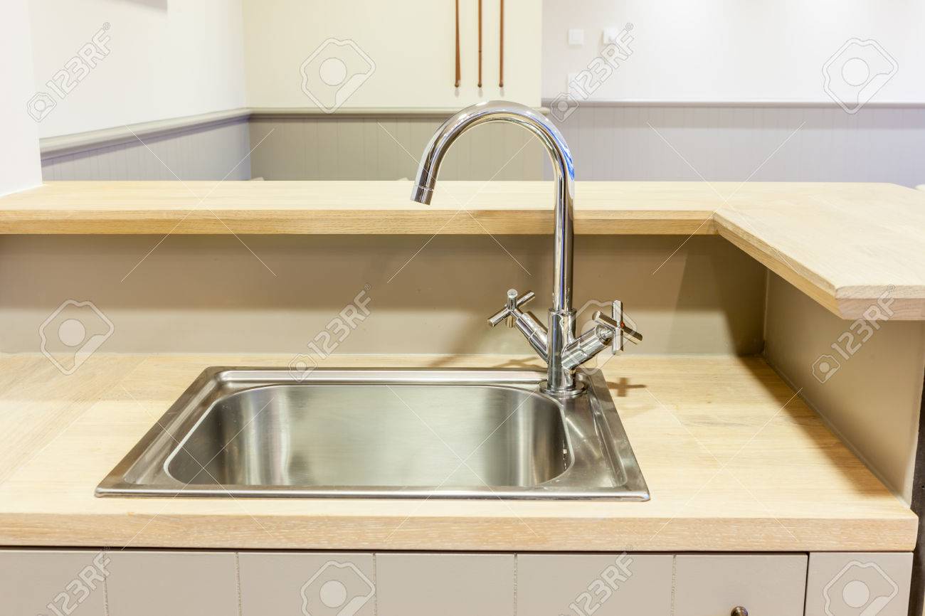 in the kitchen there is a sink built into the wood sheet - 39552263 in the kitchen there is a sink built into the wood sheet - 39552263