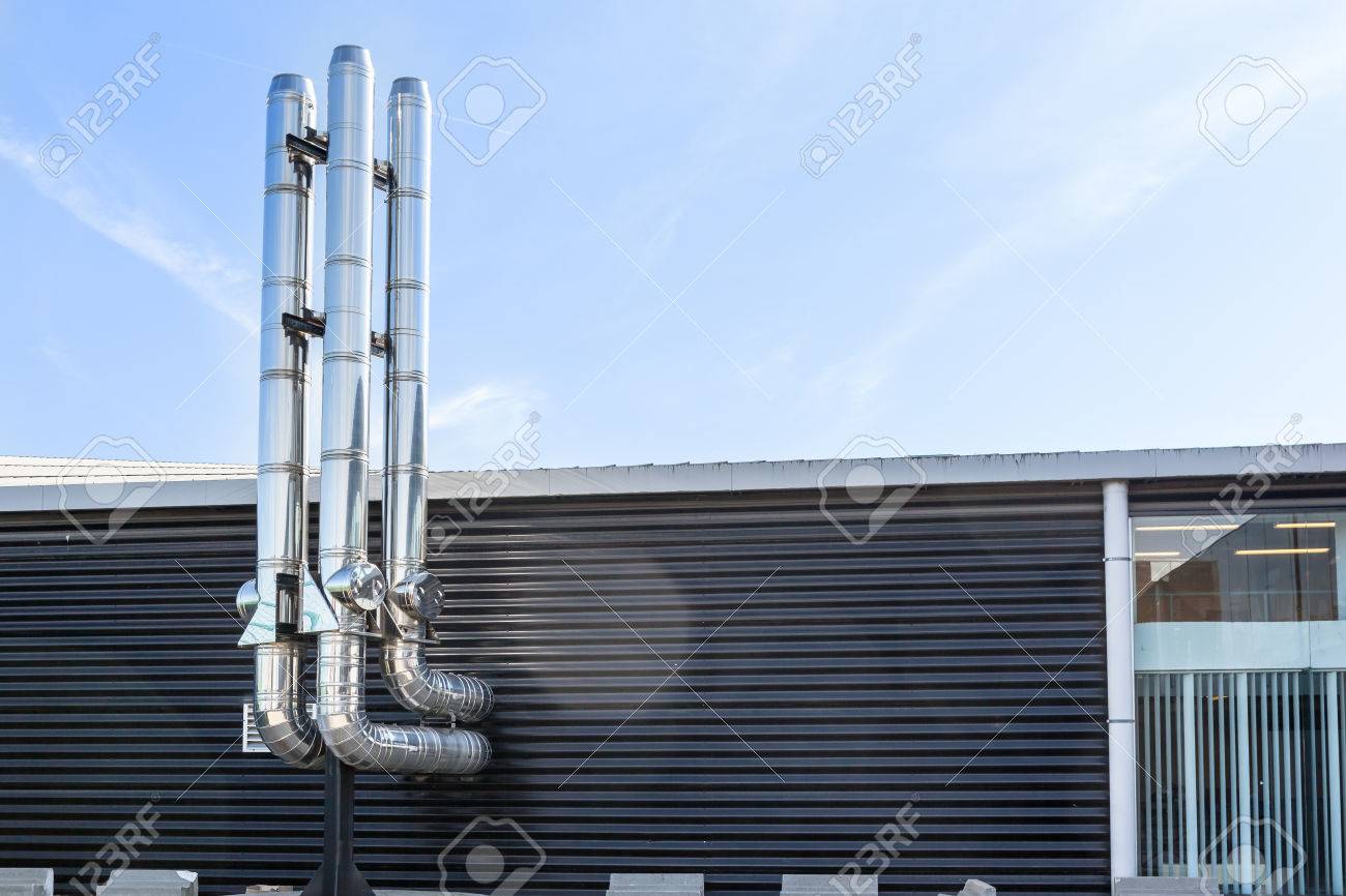 inox Chimney tube next the flat roof in the city - 74474754 inox Chimney tube next the flat roof in the city - 74474754