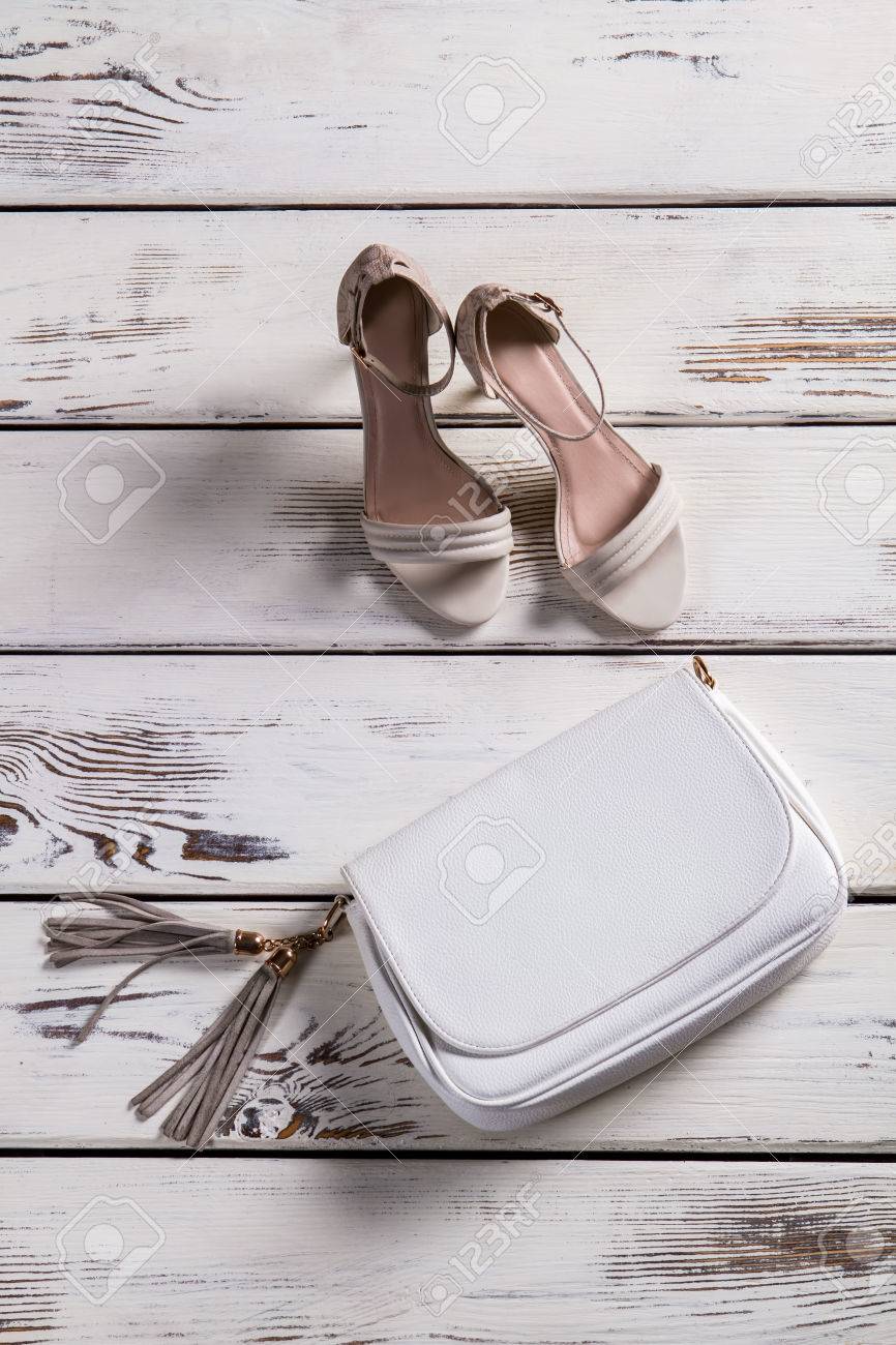 footwear for women on Small Leather Purse And Footwear Woman S Shoes On Old Shelf Stock Photo Picture And Royalty Free Image Image 55414955