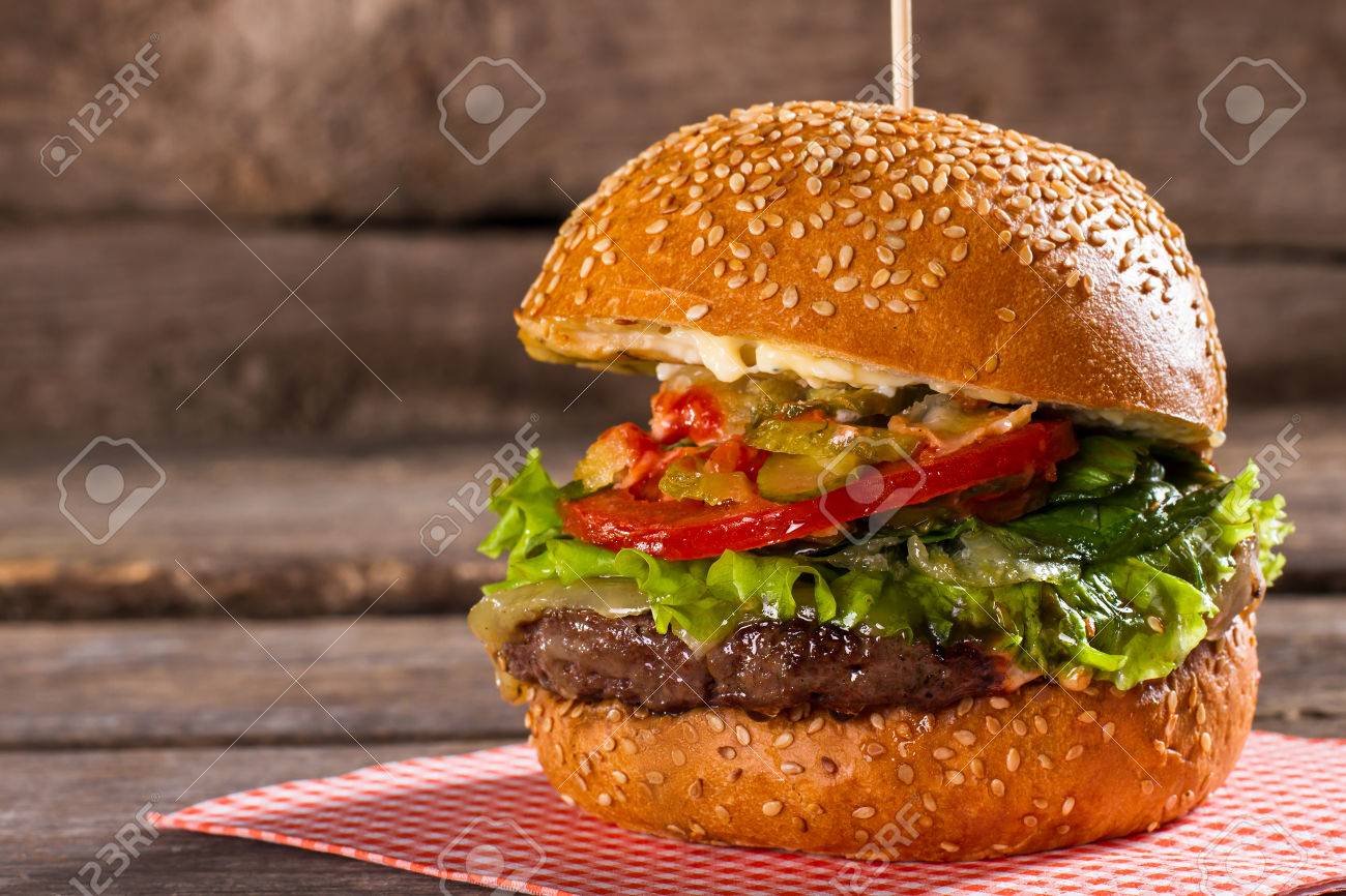 Burger With Tomatoes On Stick Freshly Cooked Hamburger On Table Juicy Beef And Fresh Tomatoes All The Needed Ingredients Stock Photo Picture And Royalty Free Image Image 55416305