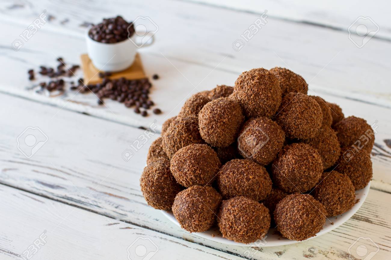 Brown Sweets On A Plate Candies On White Wooden Background Pile Of Chocolate Rum Balls Cookies And Cocoa Powder Stock Photo Picture And Royalty Free Image Image 63889241