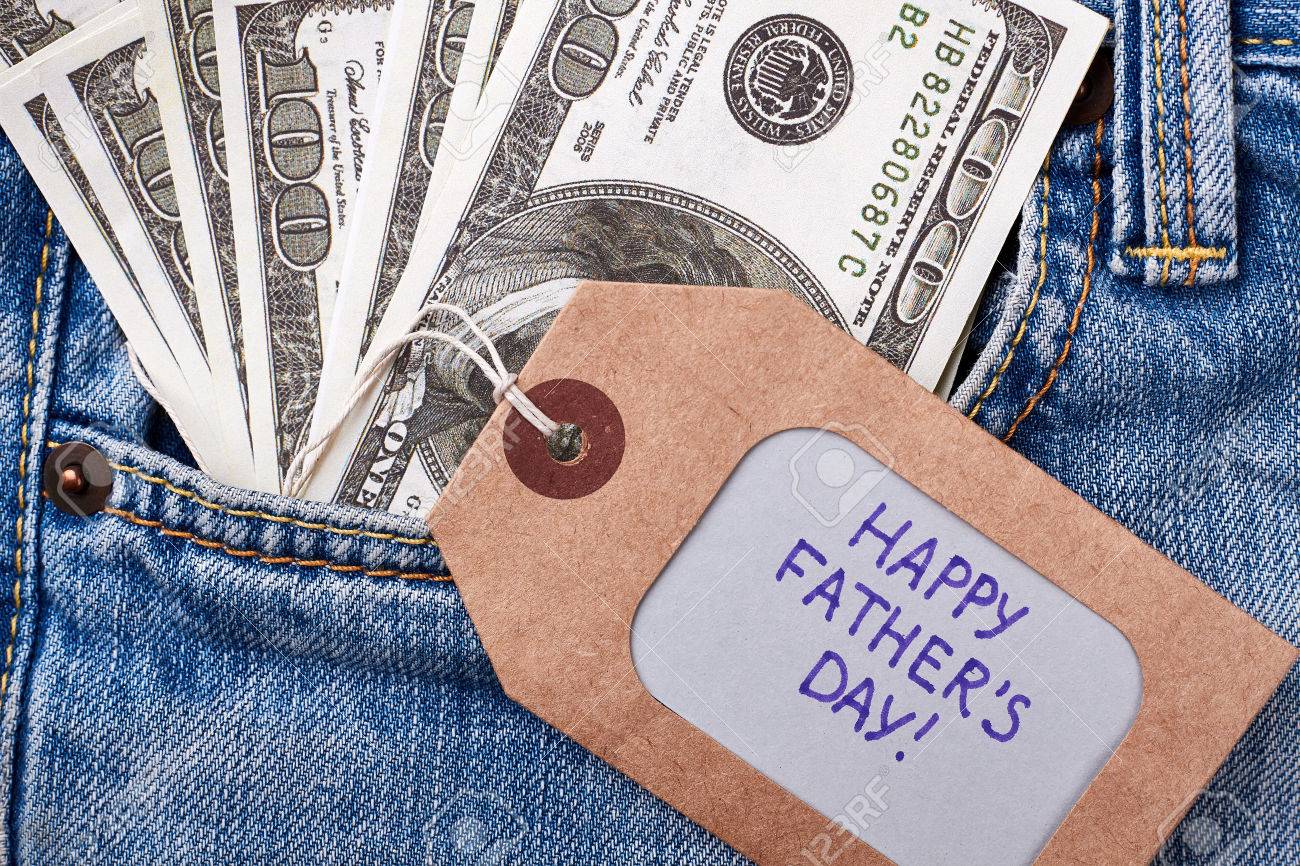 dollars near father s day label card and money on jeans template