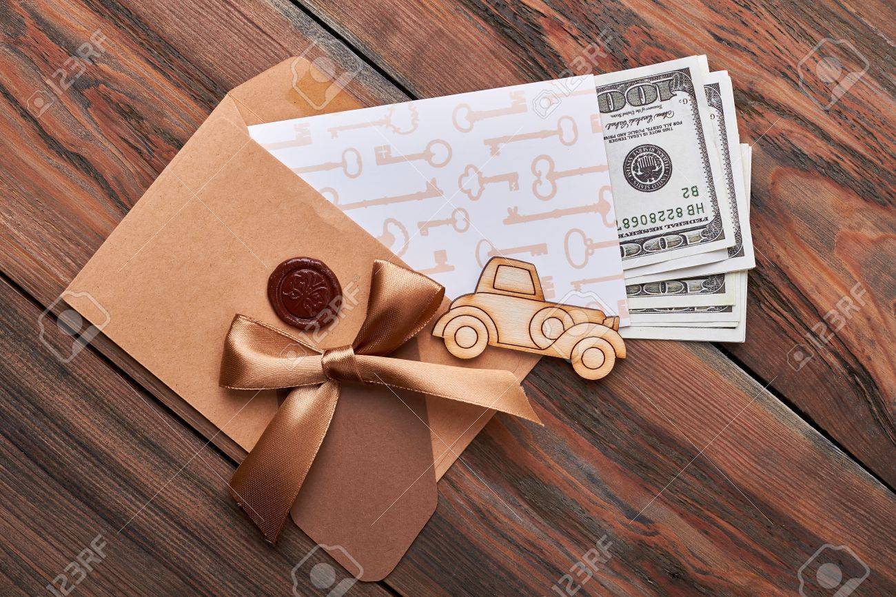 dollar bills in sealed envelope car bow key print paper broad