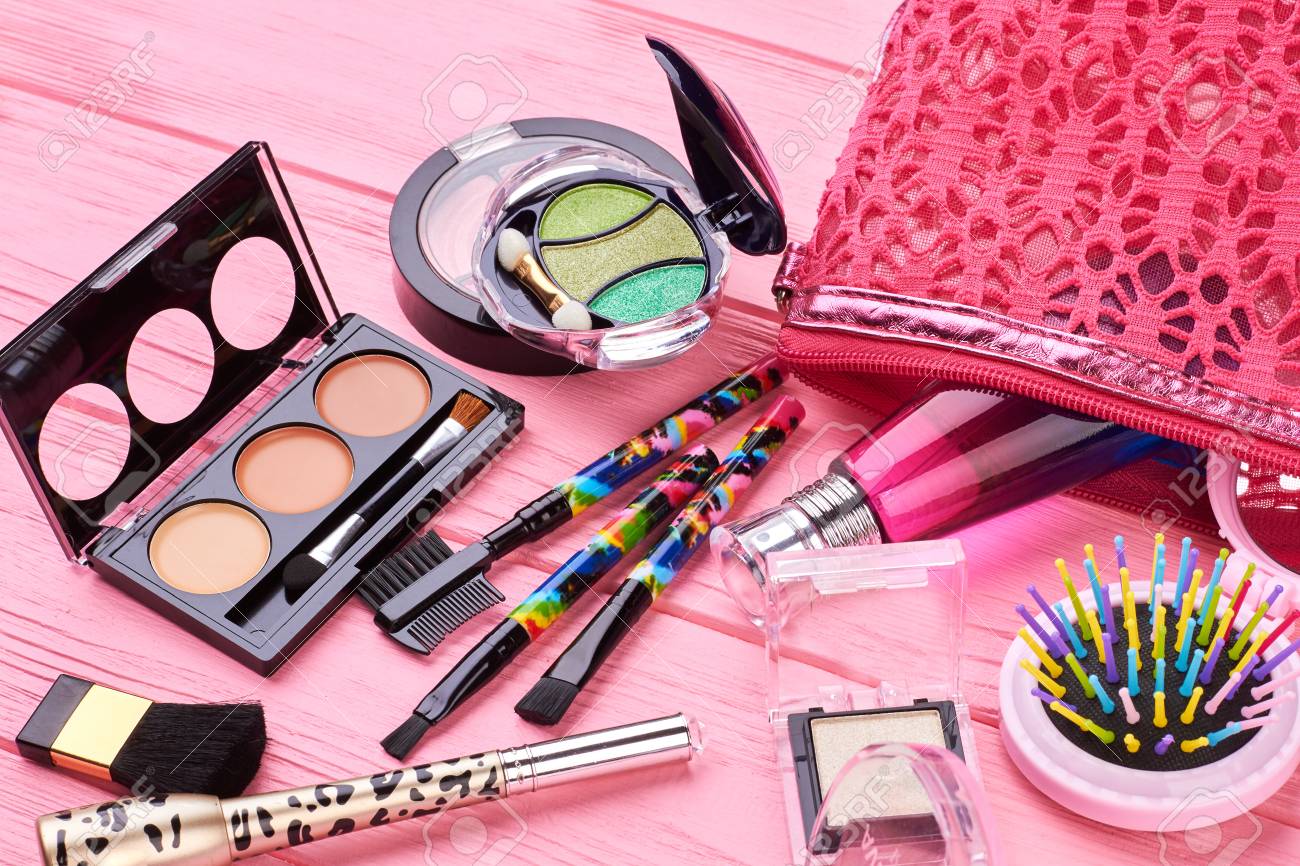 Makeup products with cosmetic bag and spring flowers. Professional Makeup  set flatlay. Set of decorative cosmetics on tender pink background. Copy  spa Stock Photo - Alamy, image size:1300x866