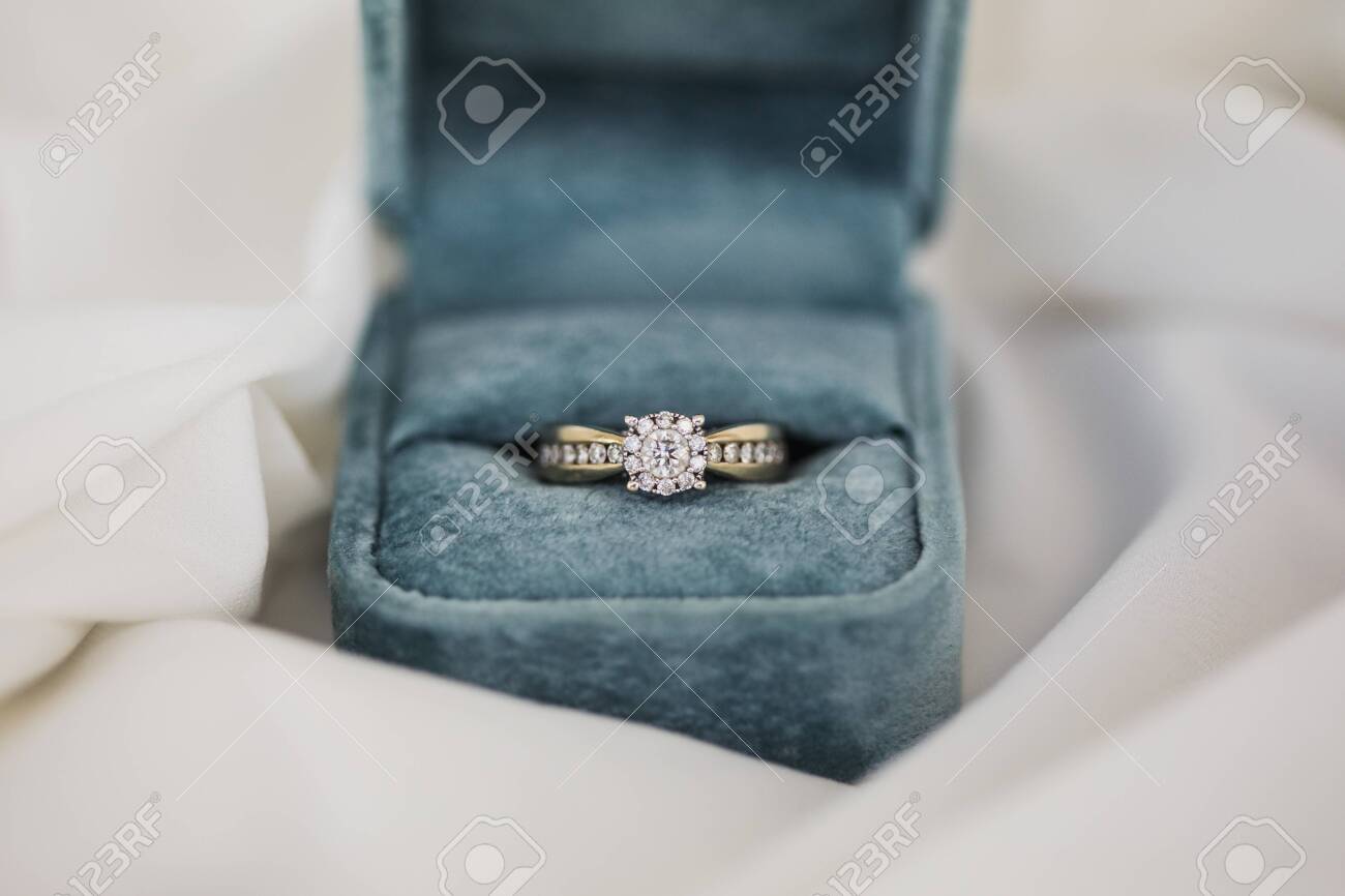 Gold wedding rings in box. Ring with diamonds - 123759025 Gold wedding rings in box. Ring with diamonds - 123759025