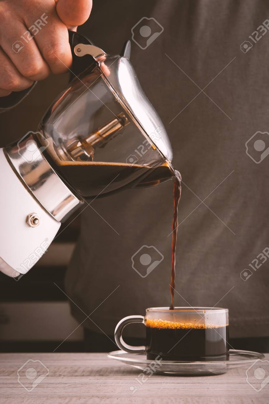 Man Pouring Coffee Into A Glass Cup Vertical Stock Photo Man Pouring Coffee Into A Glass Cup Vertical Stock Photo