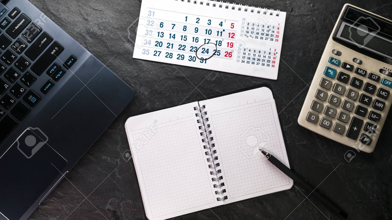 calculator and computer notebook and calendar free space stock