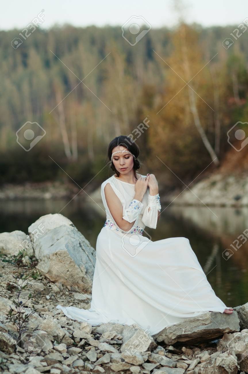 white dress by the shore