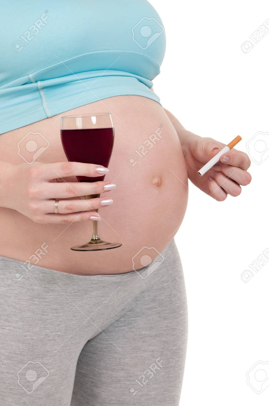 Pregnant Belly With Wine And Cigarettes Isolated Over A White Stock Photo Picture And Royalty Free Image Image 13221386