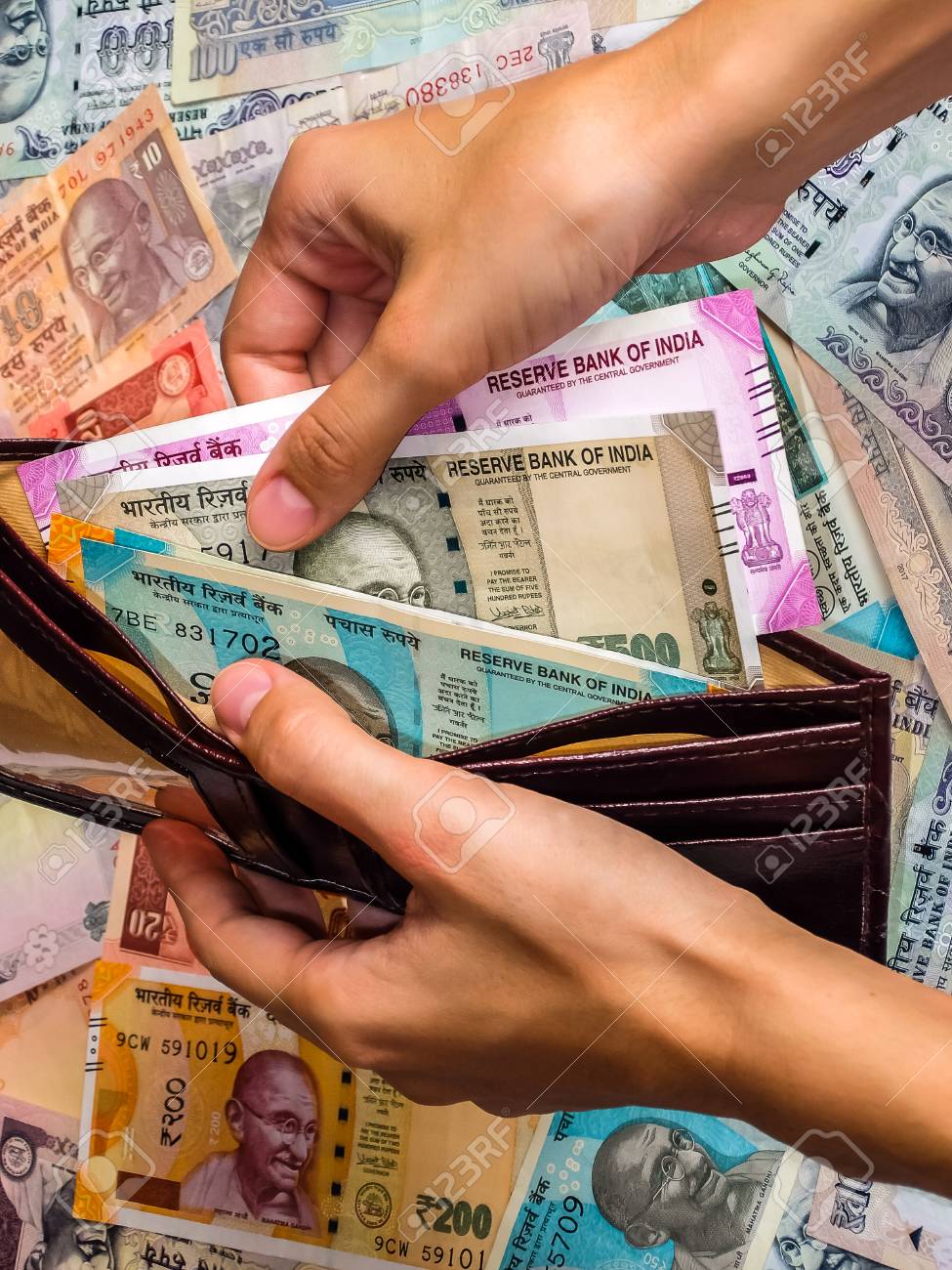 Woman S Hands Holding Wallet With Indian Notes 10 20 50 100 200 500 And 2000 Indian Rupees Old And New Notes Stock Photo Picture And Royalty Free Image Image 109176281