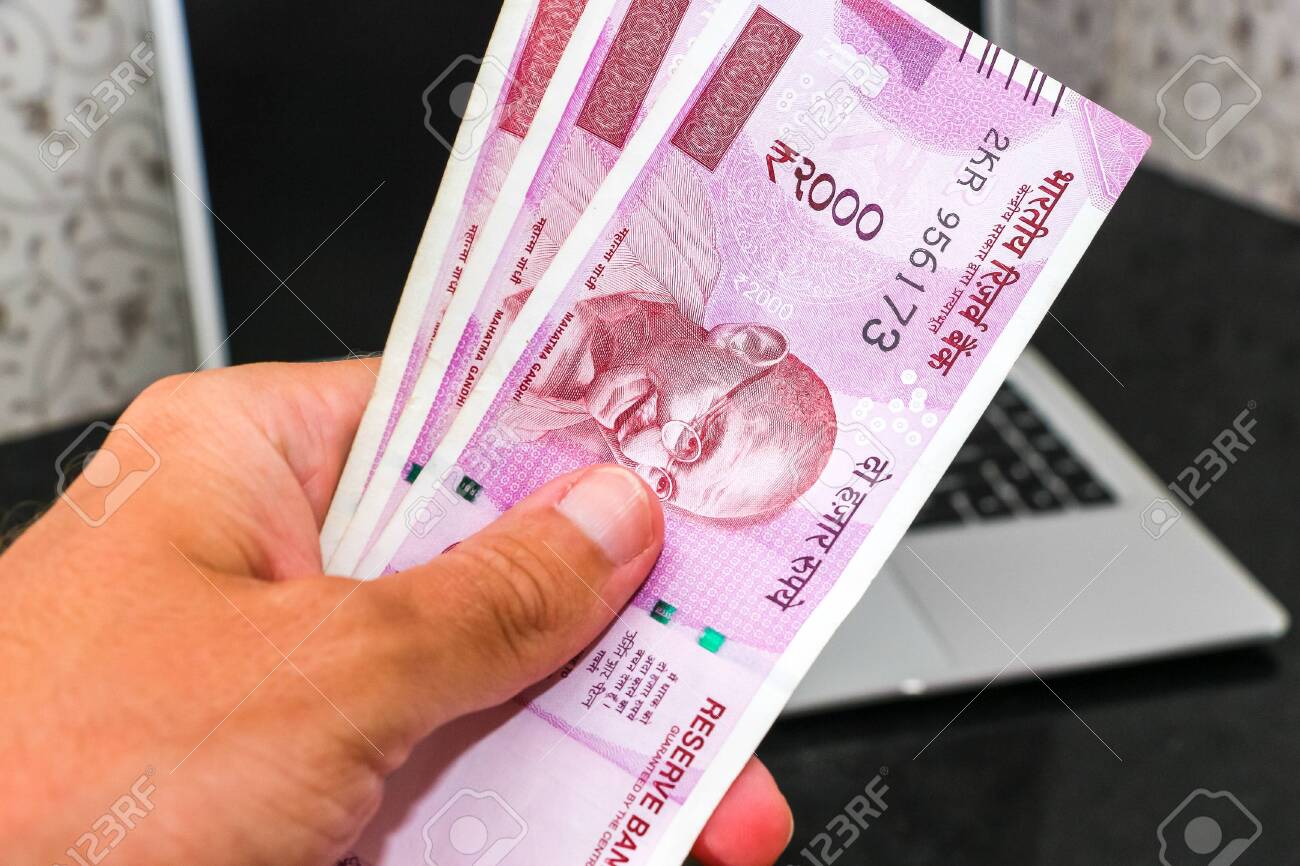 Hand Holding Brand New Indian 2000 Rupees Banknotes Laptop In Stock Photo Picture And Royalty Free Image Image 126273916 Hand Holding Brand New Indian 2000 Rupees Banknotes Laptop In Stock Photo Picture And Royalty Free Image Image 126273916