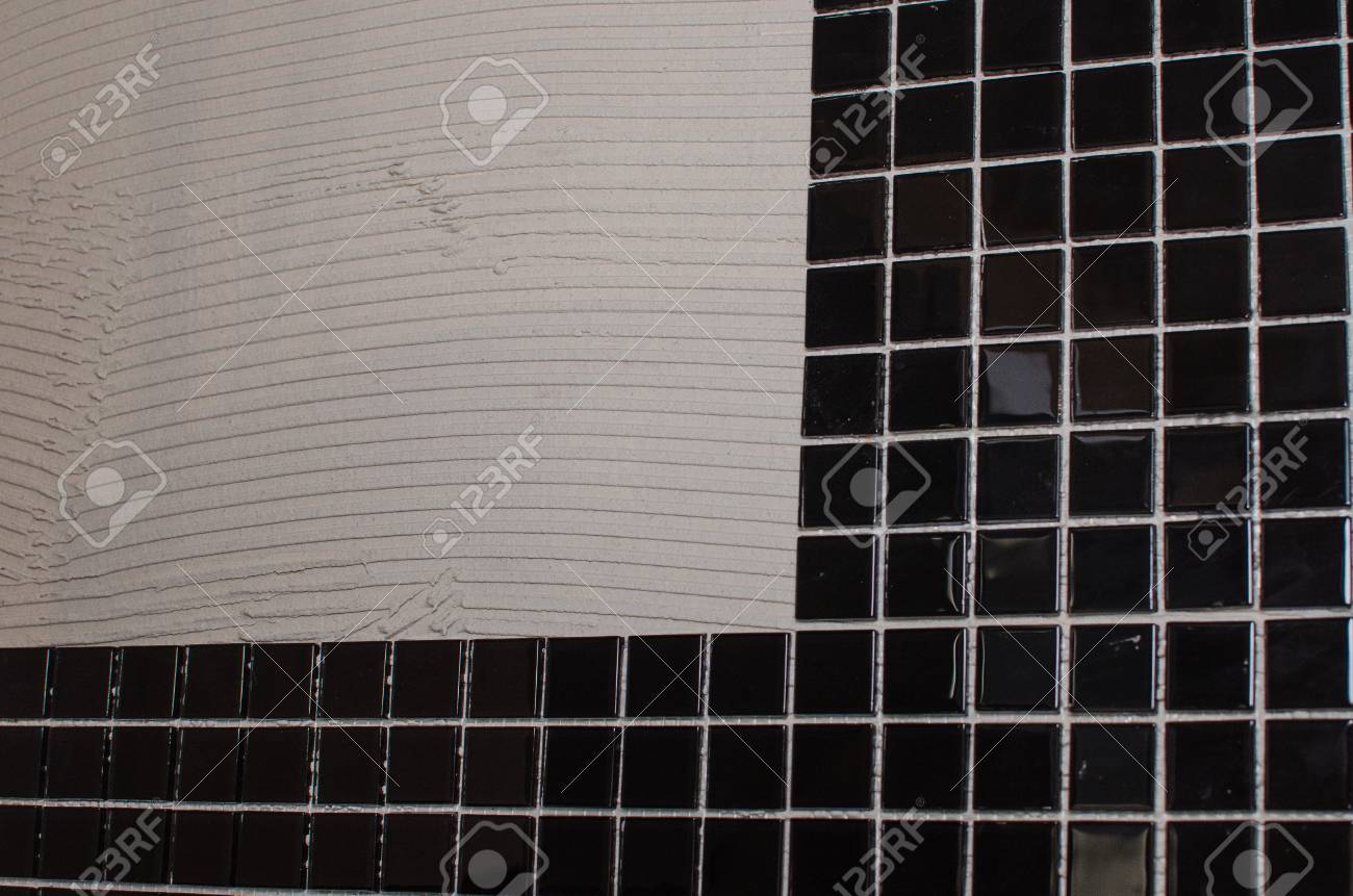 Home Repair Installing The Mosaic Tile On The Wall A Worker Stock Photo Picture And Royalty Free Image Image 117613756