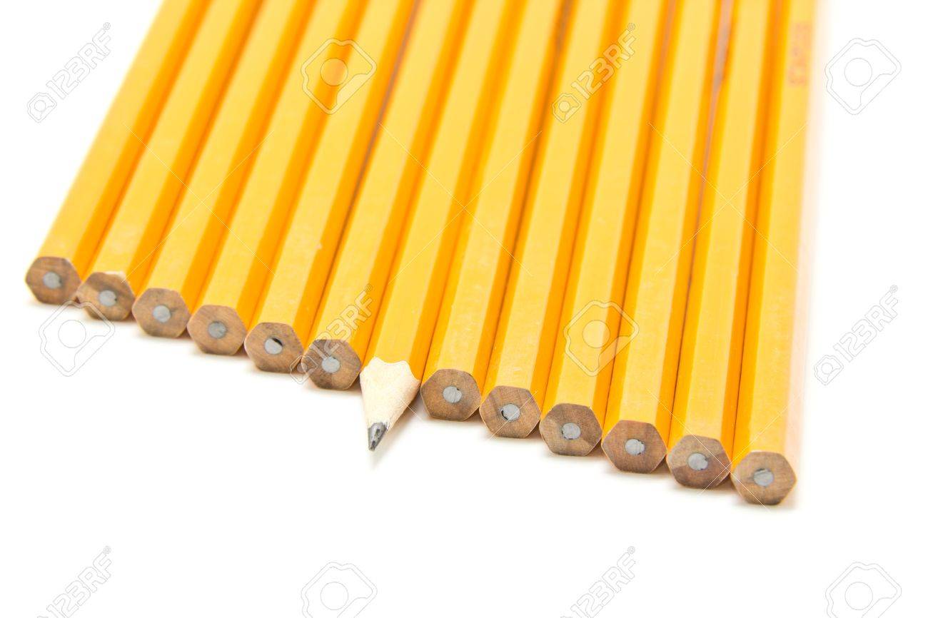a sharp pencil sticking out form a croud of dull pencils stock photo
