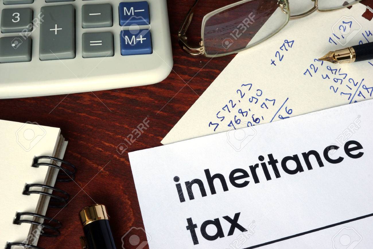 Inheritance tax written on a paper. Financial concept. - 59156282 Inheritance tax written on a paper. Financial concept. - 59156282
