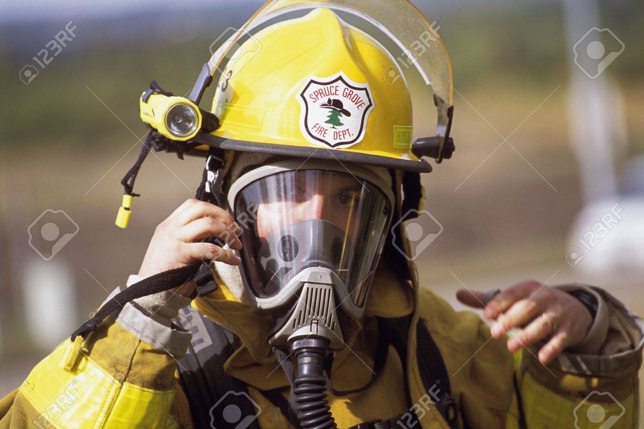 fireman adjusting mask stock photo picture and royalty free image