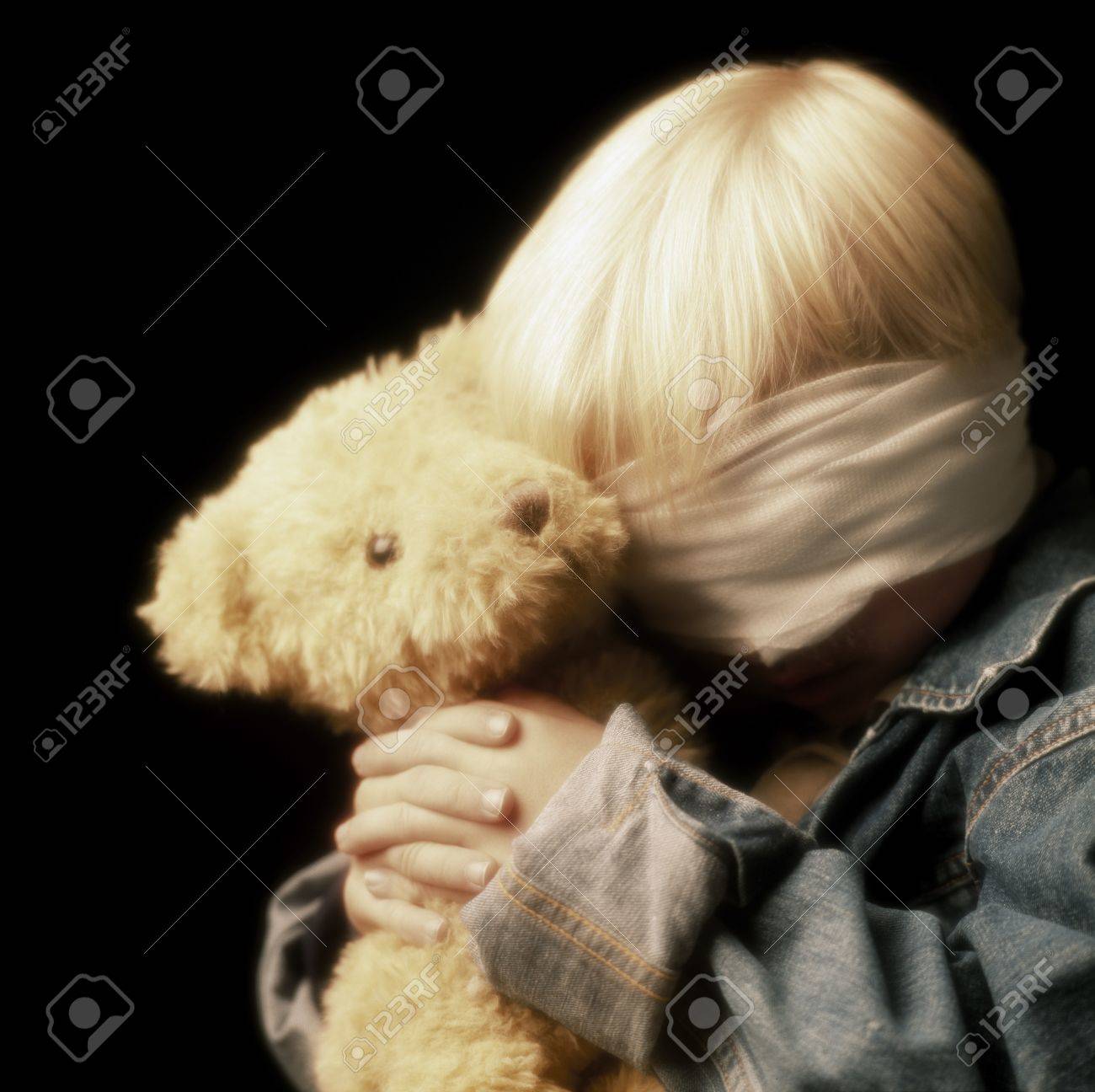 rat holding teddy bear