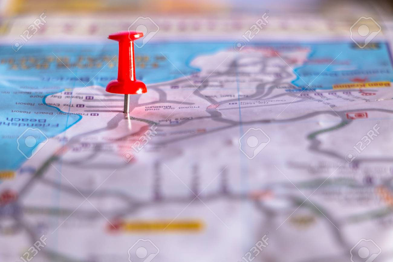 travel destination pin points on a map with colorful thumbtacks