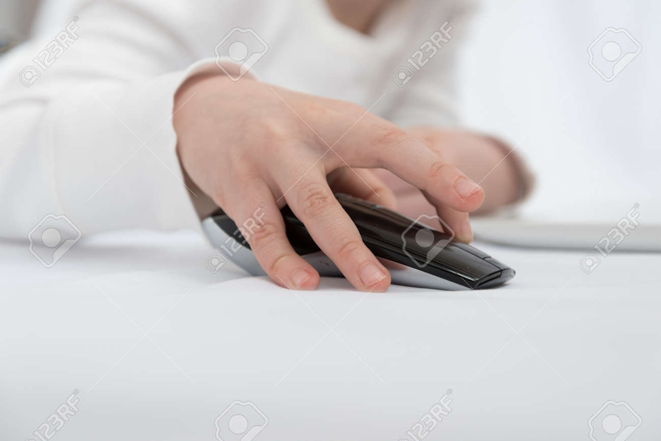 Childrens hand close up. The child is engaged or plays in the laptop using a wireless mouse - 168593046 Childrens hand close up. The child is engaged or plays in the laptop using a wireless mouse - 168593046