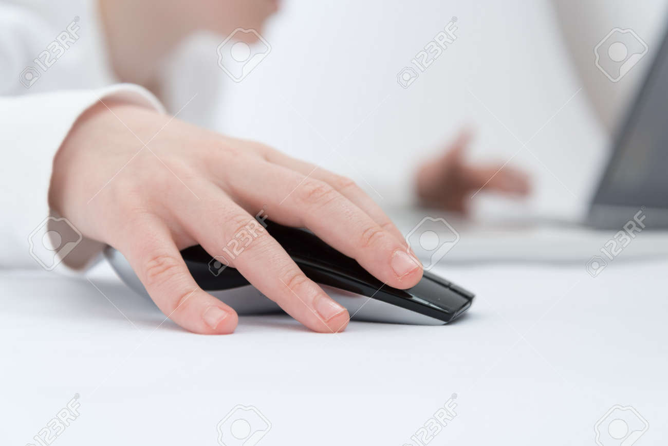 Childrens hand close up. The child is engaged or plays in the laptop using a wireless mouse - 168593053 Childrens hand close up. The child is engaged or plays in the laptop using a wireless mouse - 168593053
