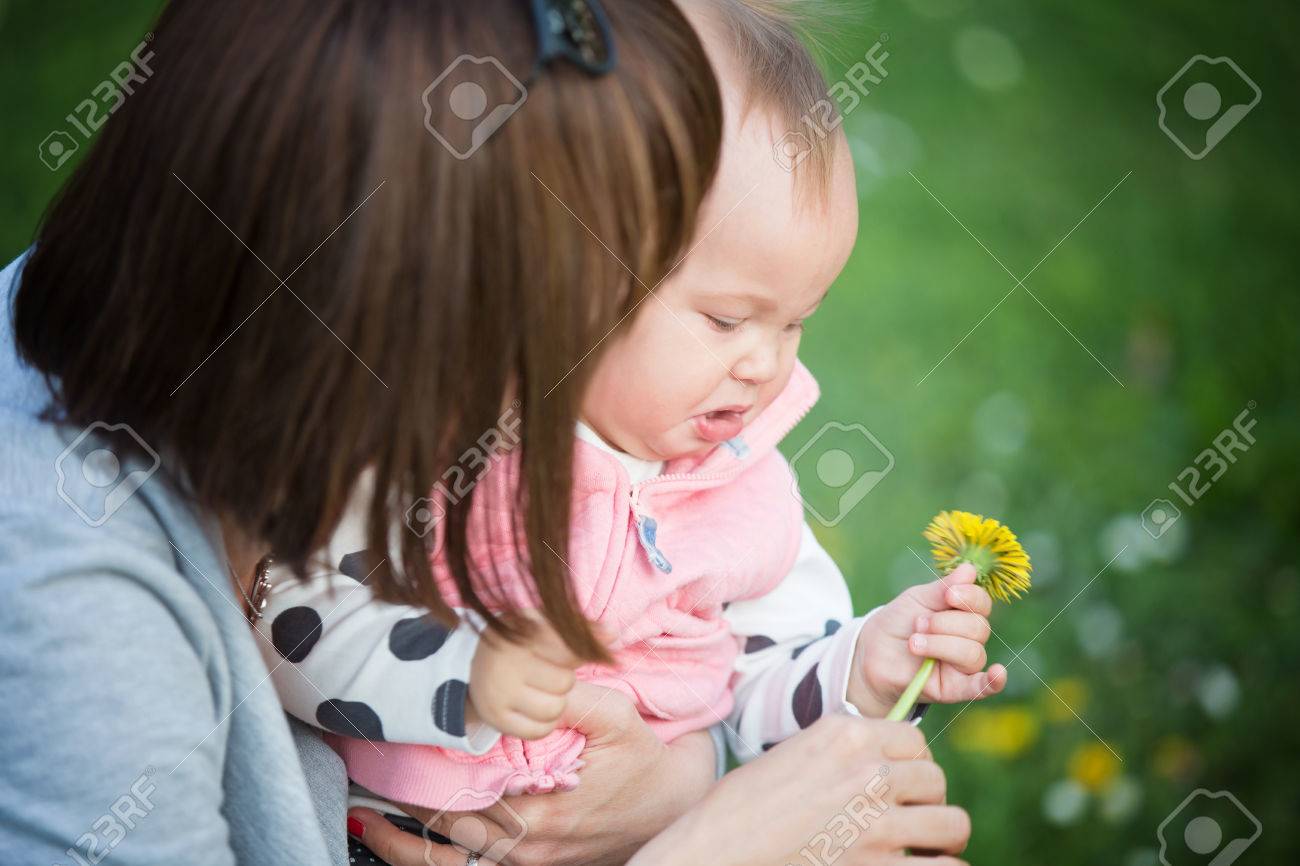 mother holding her one