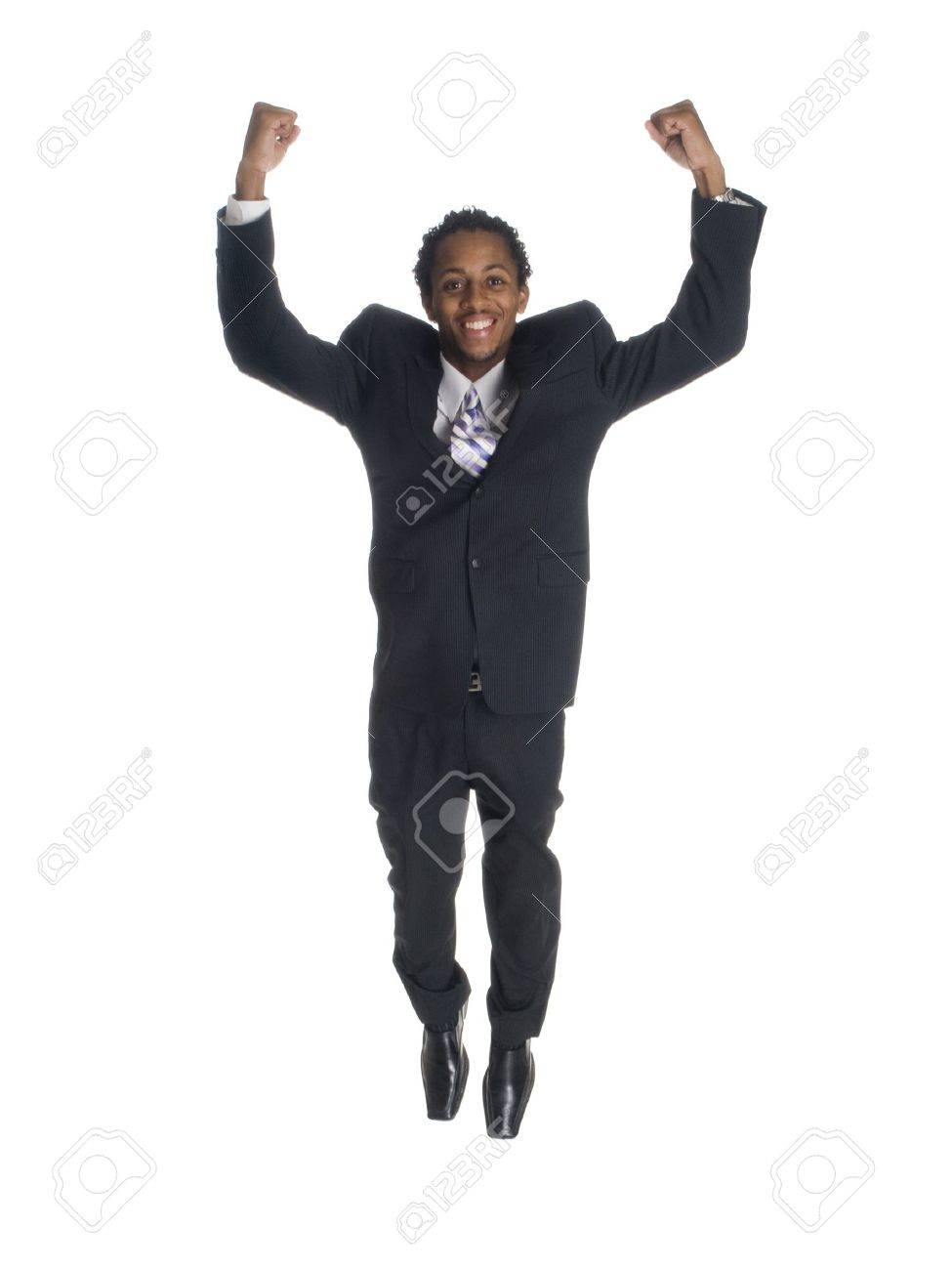 isolated studio shot of a businessman jumping for joy with clenched