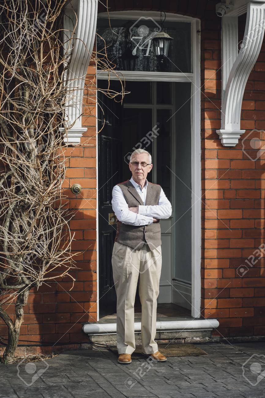 Happy Senior Man Standing Outside The Front Door Of His Home ... Happy Senior Man Standing Outside The Front Door Of His Home ...