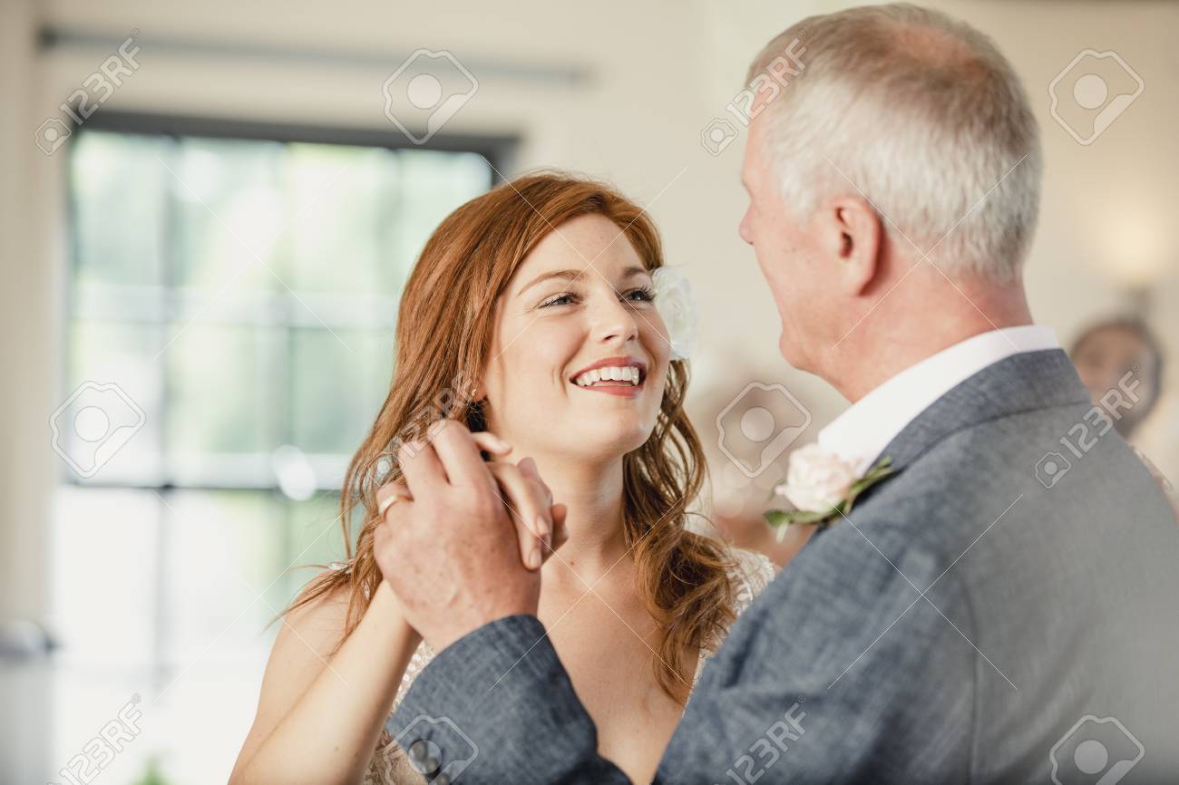 Beautiful bride is enjoying a dance with her father on her wedding day. - 94034909 Beautiful bride is enjoying a dance with her father on her wedding day. - 94034909