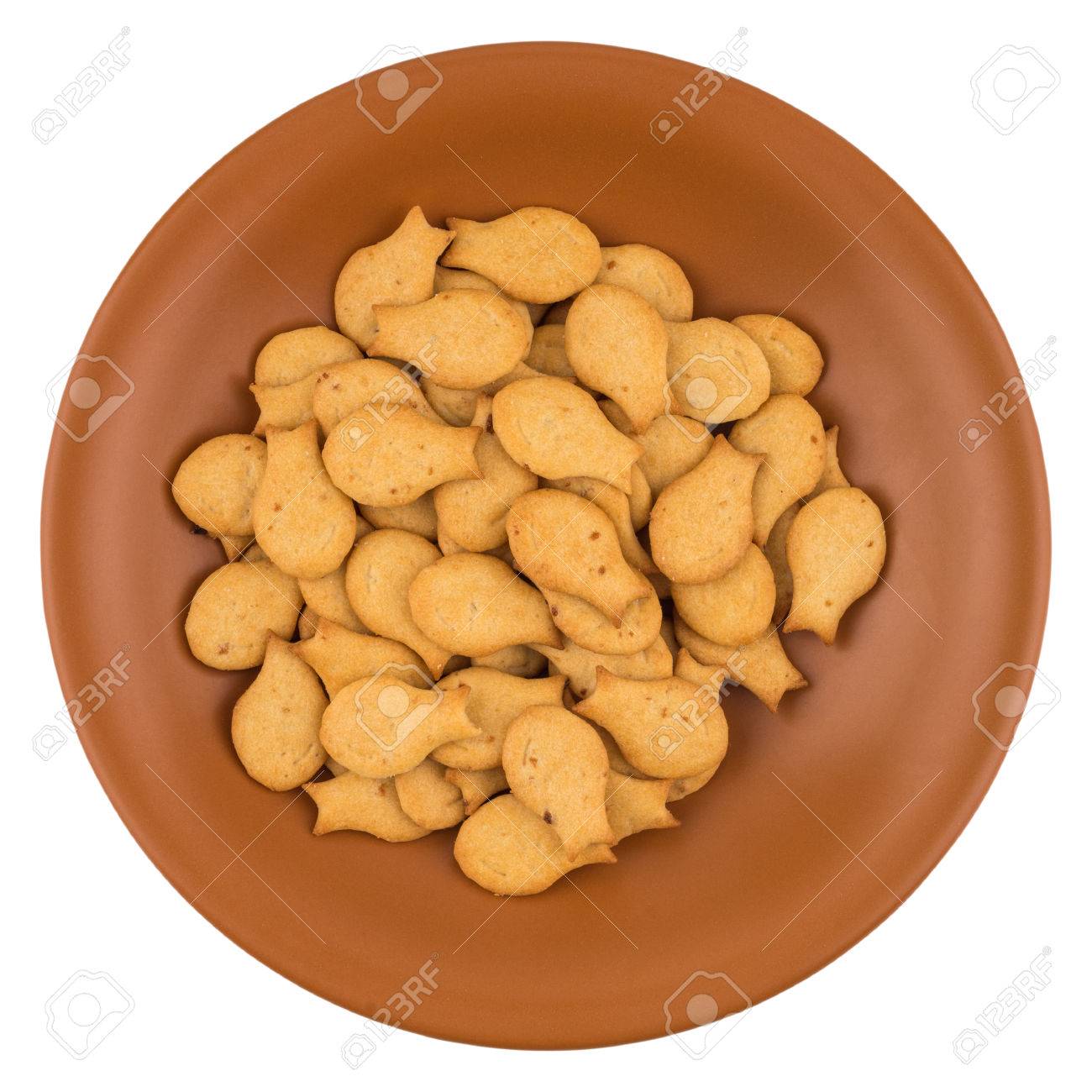 Goldfish Crackers In Brown Plate Isolated On White Background Stock Photo Picture And Royalty Free Image Image 81184512
