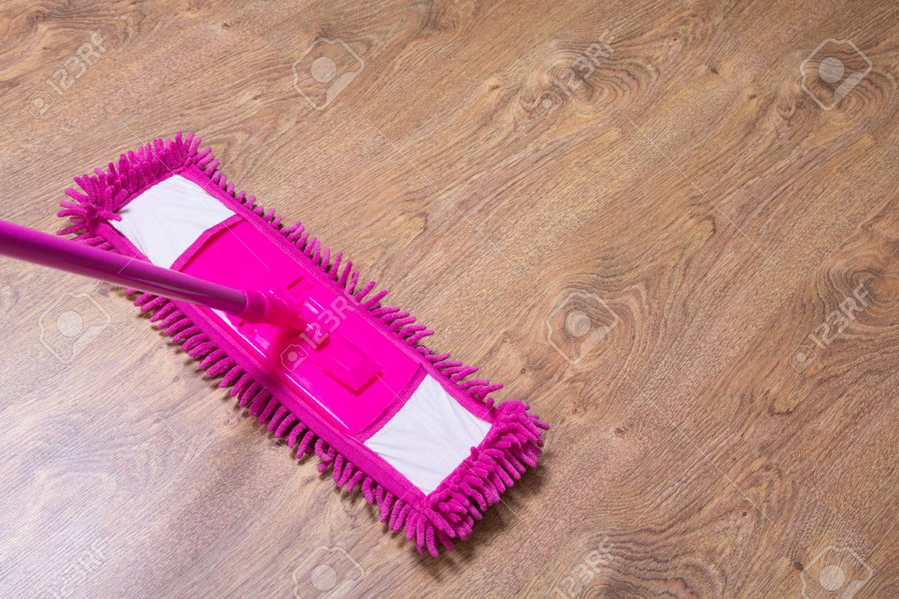 Cleaning The Parquet Floor With Wet Pink Mop Stock Photo Picture