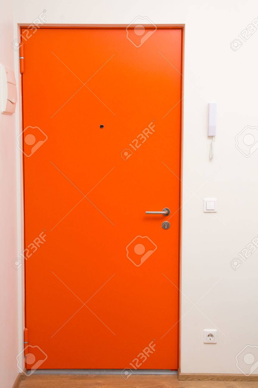 interior apartment orange door over white wall stock photo interior apartment orange door over white wall stock photo