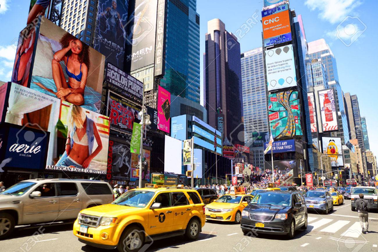 New York, New York, USA - May 08, 2016: Cars and taxi cabs on 7th Avenue and Broadway in Times Square with crowds of people and lots of advertising - 59111545 New York, New York, USA - May 08, 2016: Cars and taxi cabs on 7th Avenue and Broadway in Times Square with crowds of people and lots of advertising - 59111545