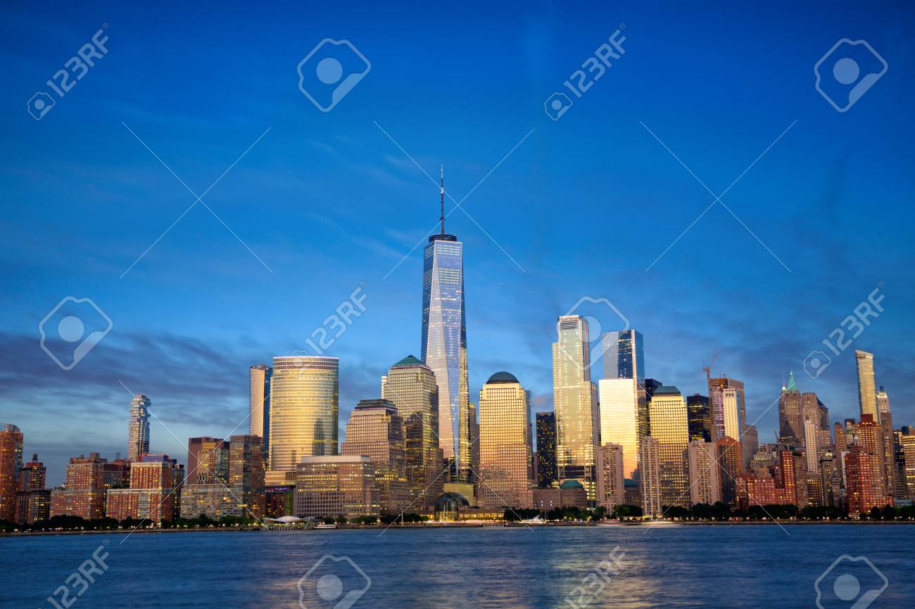 New York City Manhattan skyline with modern skyscrapers at dusk - 116745822 New York City Manhattan skyline with modern skyscrapers at dusk - 116745822