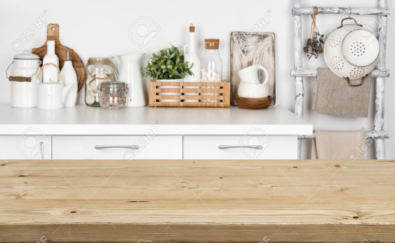 Brown wooden texture table over blurred image of kitchen bench - 92549889 Brown wooden texture table over blurred image of kitchen bench - 92549889