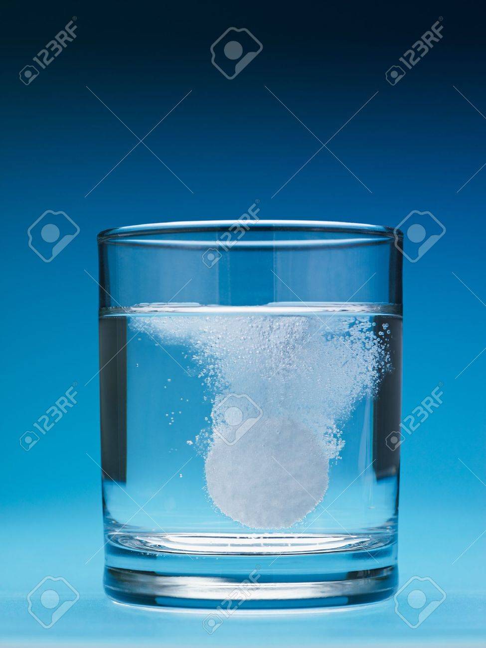 closeup of painkiller tablet in glass of water. Vertical shape, copy space - 7513228 closeup of painkiller tablet in glass of water. Vertical shape, copy space - 7513228