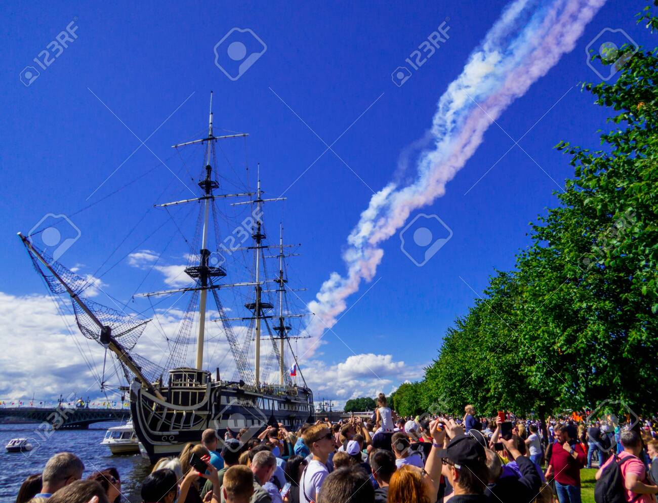 St. Petersburg, Russia - July 26, 2020: People watching the annual celebrations for the Navy Day on the embankment of the Neva River. - 152365069 St. Petersburg, Russia - July 26, 2020: People watching the annual celebrations for the Navy Day on the embankment of the Neva River. - 152365069