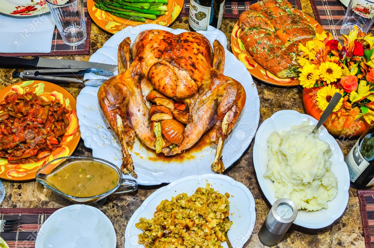 table set up before thanksgiving dinner with turkey, gravy table set up before thanksgiving dinner with turkey, gravy