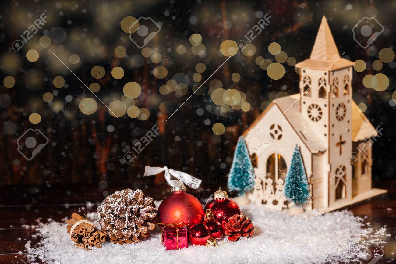 rustic winter christmas scene with church and gifts stock photo rustic christmas scene