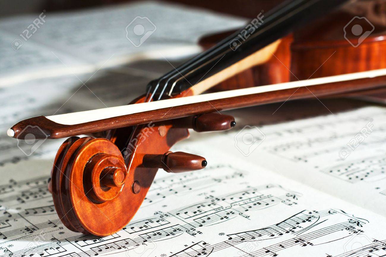 Detail of a beautiful violin with the score Stock
