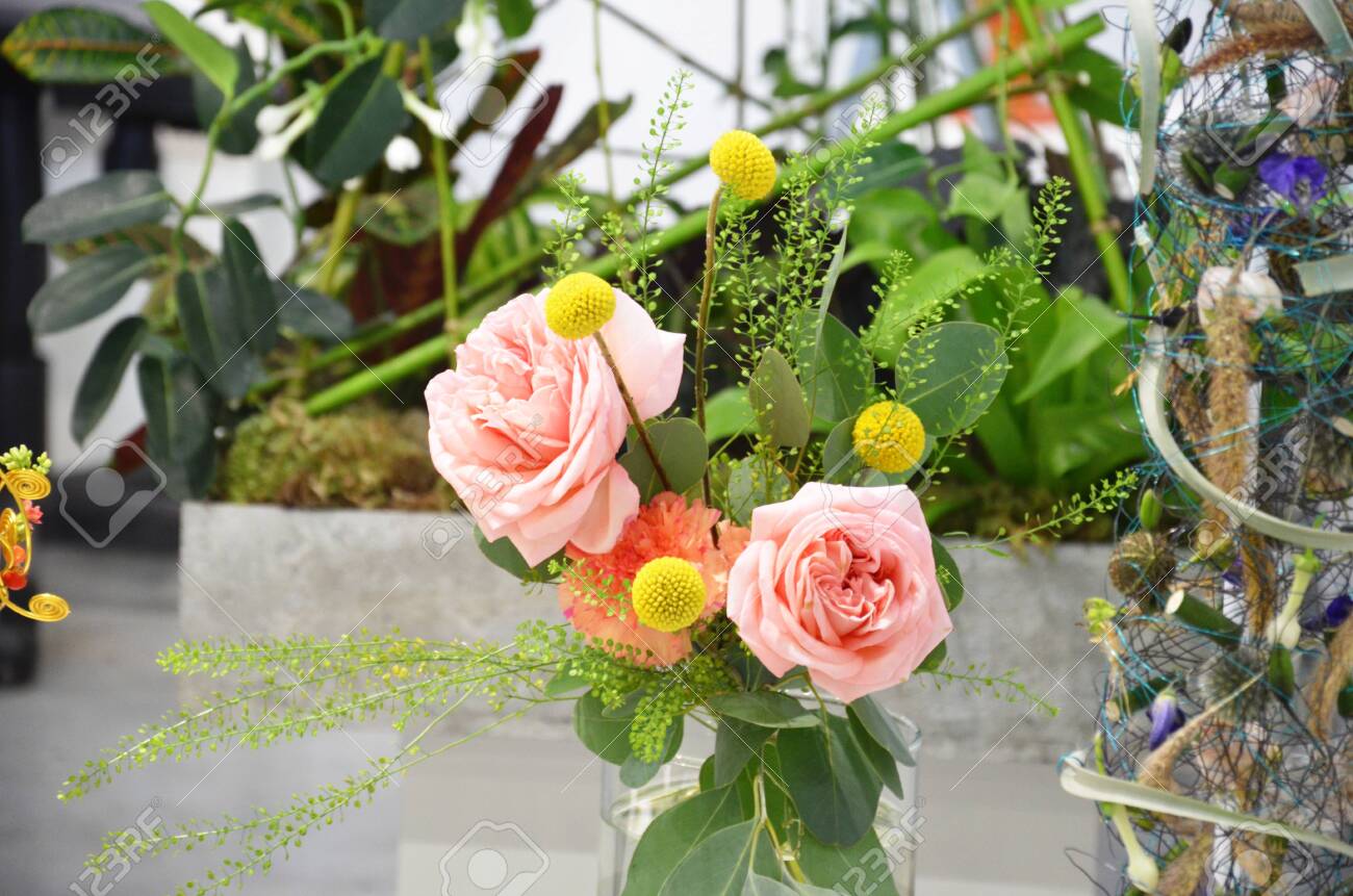 Floral shop concept Florist creates flower in a wicker basket. Beautiful bouquet mixed flowers. fresh bunch. Flowers delivery. Colorful bouquet of different orchids, roses, freesia eucalyptus leaves - 147236859 Floral shop concept Florist creates flower in a wicker basket. Beautiful bouquet mixed flowers. fresh bunch. Flowers delivery. Colorful bouquet of different orchids, roses, freesia eucalyptus leaves - 147236859