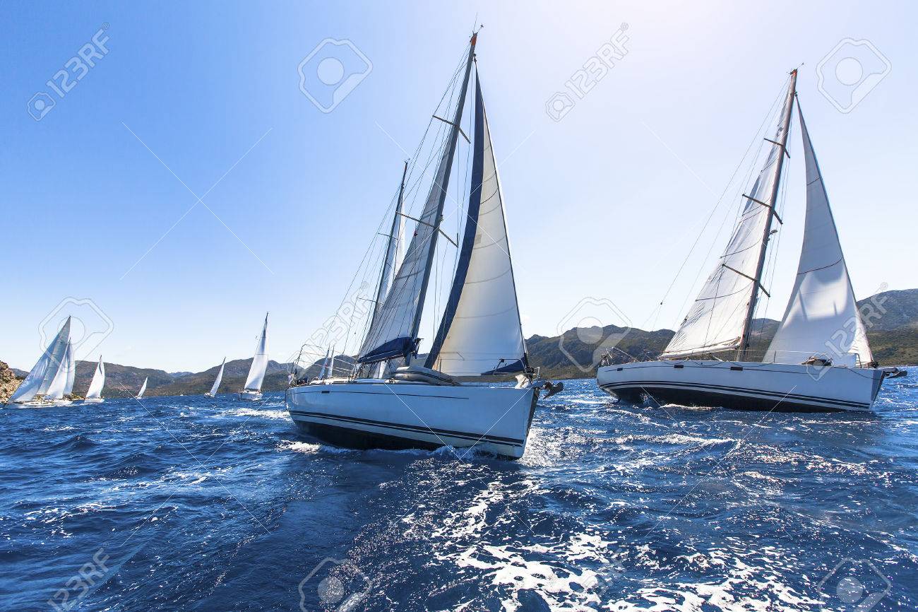 Sailing in the wind through the waves at the Aegean Sea in Greece. Sailing regatta. Luxury yachts. - 39199173 Sailing in the wind through the waves at the Aegean Sea in Greece. Sailing regatta. Luxury yachts. - 39199173