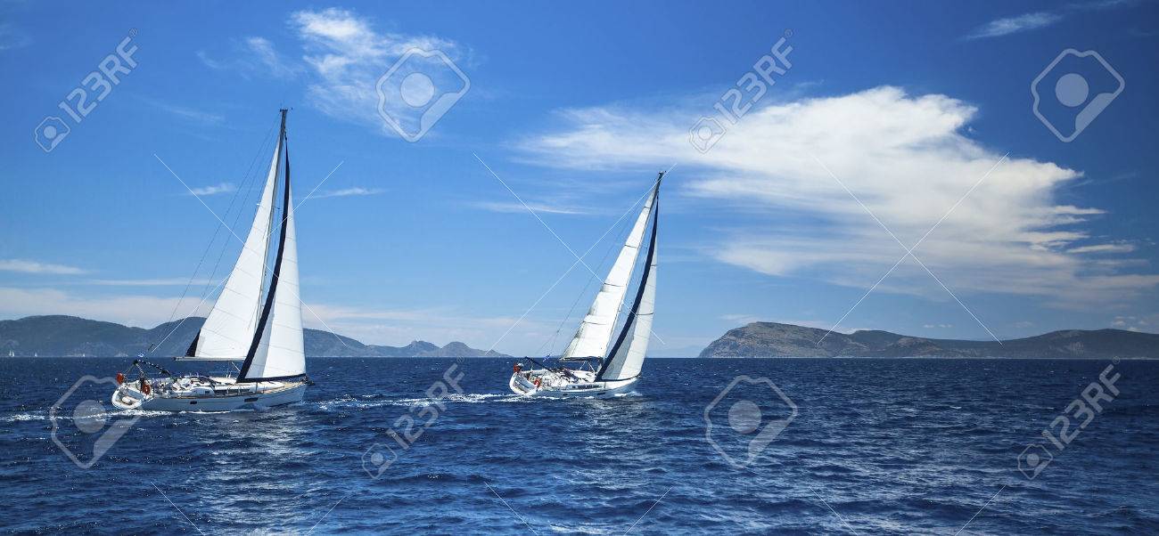 Sailing in the wind through the waves at the Aegean Sea in Greece. - 39326686 Sailing in the wind through the waves at the Aegean Sea in Greece. - 39326686