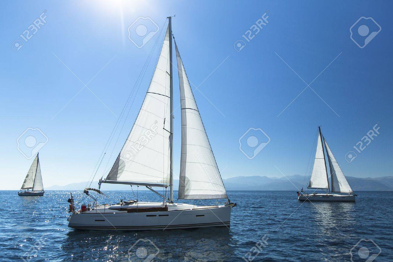 Sailing regatta. Sailing in the wind through the waves. Luxury yachts. - 47683411 Sailing regatta. Sailing in the wind through the waves. Luxury yachts. - 47683411
