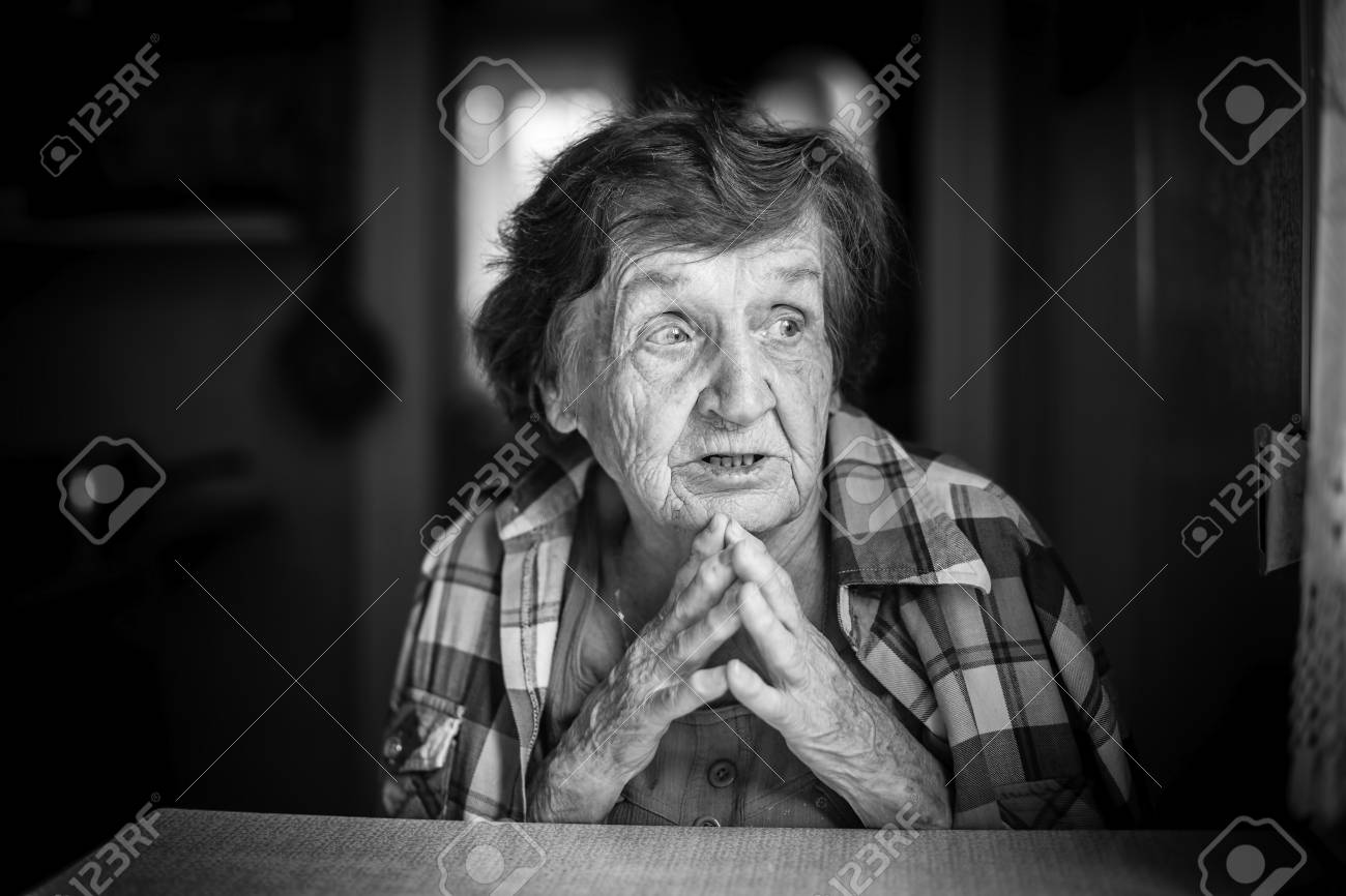 Emotional portrait of an elderly woman black and white photo stock photo 74481568