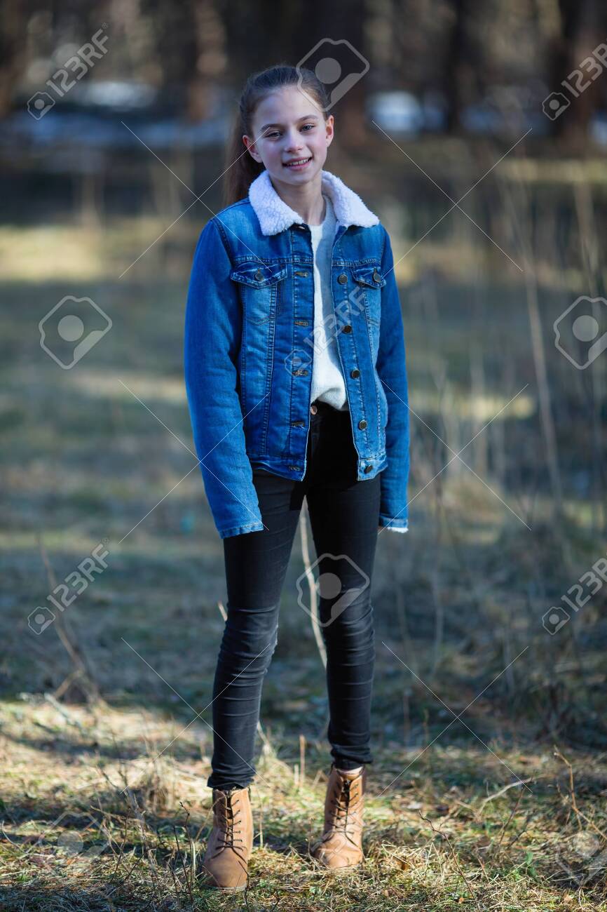 Full-length Portrait Of Cute Twelve Year Old Girl In The Park. Фотография,  картинки, изображения и сток-фотография без роялти. Image 123082592