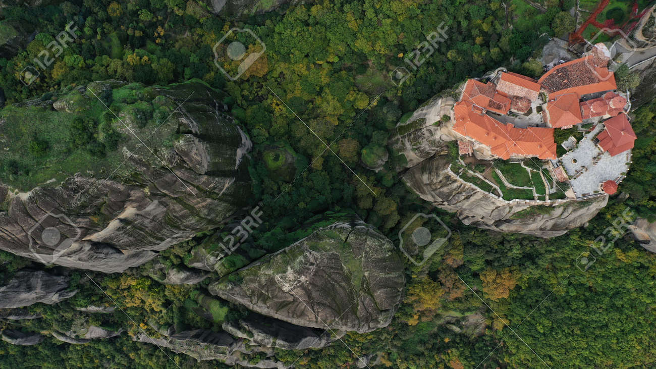 Aerial view of historical orthodox monasteries on the top of meteors cliffs, Kalampaka Kalabaka Kalambaka, Greece. Beautiful mountainous landscape with rocky cliffs. - 140592682 Aerial view of historical orthodox monasteries on the top of meteors cliffs, Kalampaka Kalabaka Kalambaka, Greece. Beautiful mountainous landscape with rocky cliffs. - 140592682